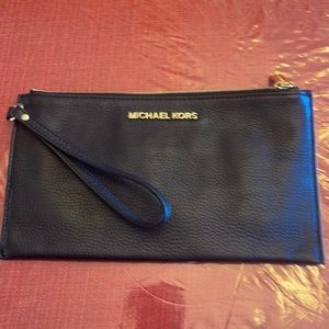 Authentic MK pebbled leather clutch